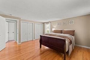 19 Station St, Wareham, MA 02571 - bedroom with two closets, light wood finished floors, and baseboards