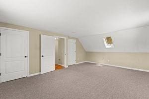 19 Station St, Wareham, MA 02571 - additional living space with carpet floors, lofted ceiling, and baseboards