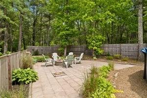 19 Station St, Wareham, MA 02571 - fenced backyard featuring a patio and a fire pit