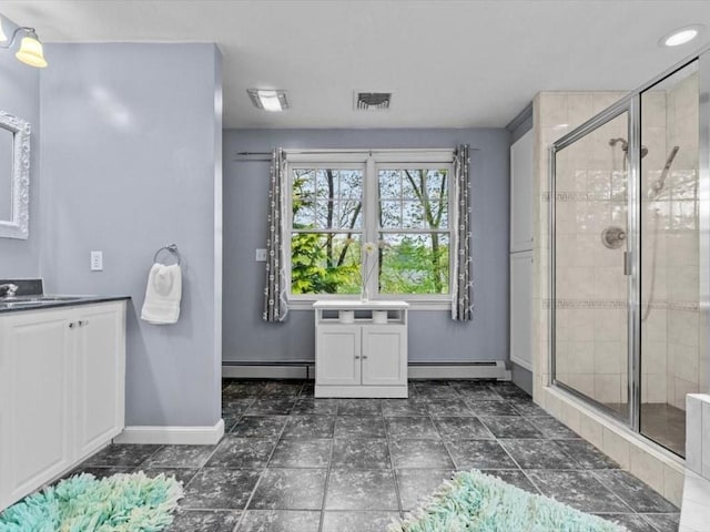 bathroom with a baseboard radiator, baseboards, and a shower stall