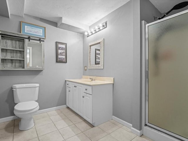 bathroom featuring a shower stall, baseboards, toilet, and vanity