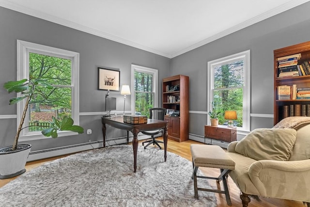 office space with a baseboard heating unit, wood finished floors, and crown molding