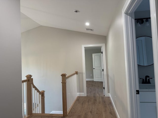 1269 Bartlett St, New Bedford, MA 02745 - corridor featuring an upstairs landing, vaulted ceiling, and wood finished floors