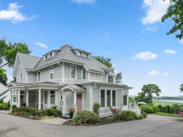 view of property exterior with a porch