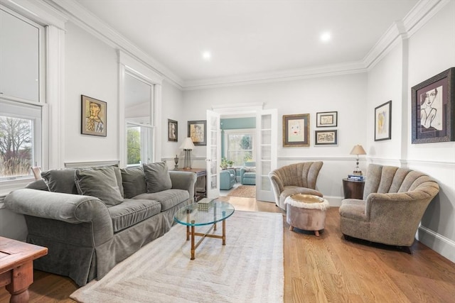 living room featuring recessed lighting, crown molding, and wood finished floors