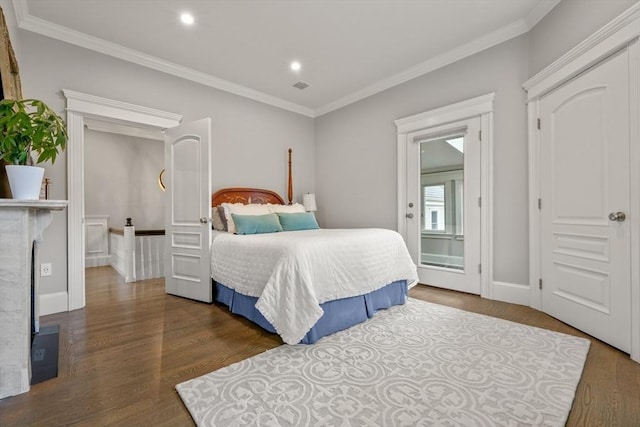 bedroom featuring ornamental molding, dark wood-type flooring, visible vents, and recessed lighting