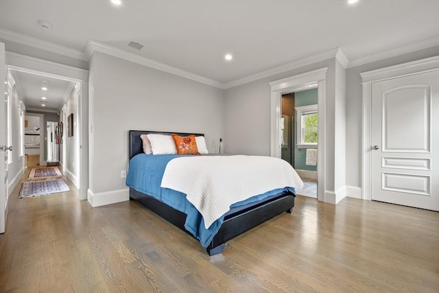 bedroom featuring recessed lighting, baseboards, ornamental molding, visible vents, and wood finished floors