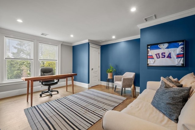 office space featuring wood finished floors, crown molding, visible vents, baseboards, and recessed lighting