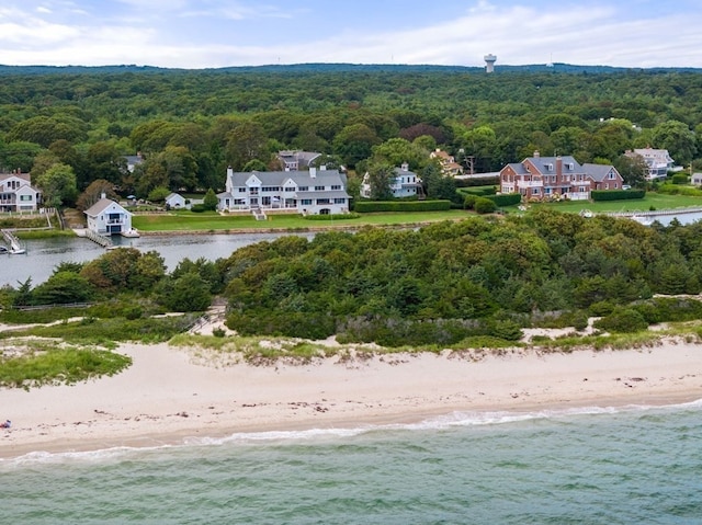 bird's eye view with a beach view and a water view