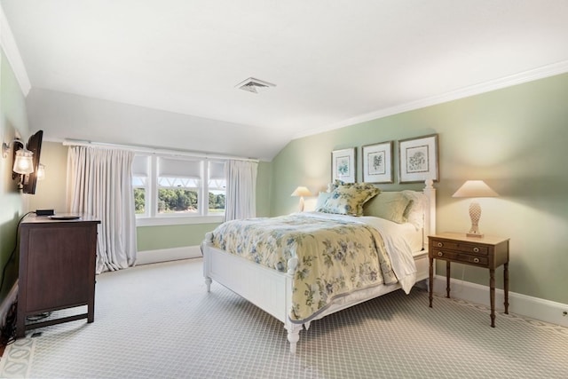 bedroom featuring light carpet, ornamental molding, and vaulted ceiling