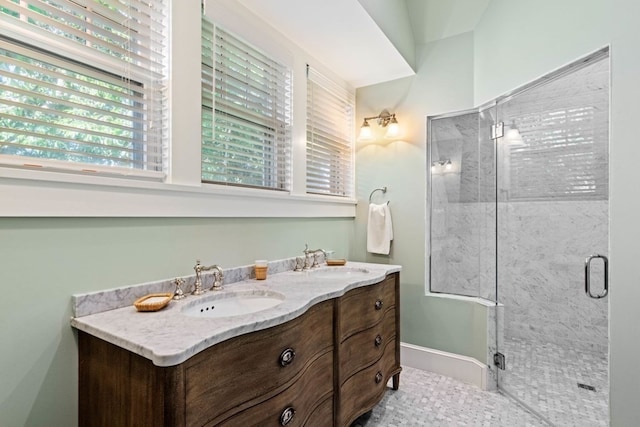 bathroom with dual vanity, tile flooring, and walk in shower