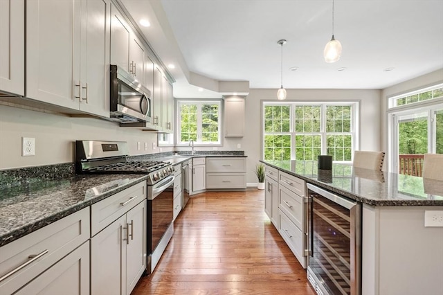 233A Green St, Boylston, MA 01505 - kitchen with beverage cooler, appliances with stainless steel finishes, plenty of natural light, light wood-style floors, and recessed lighting