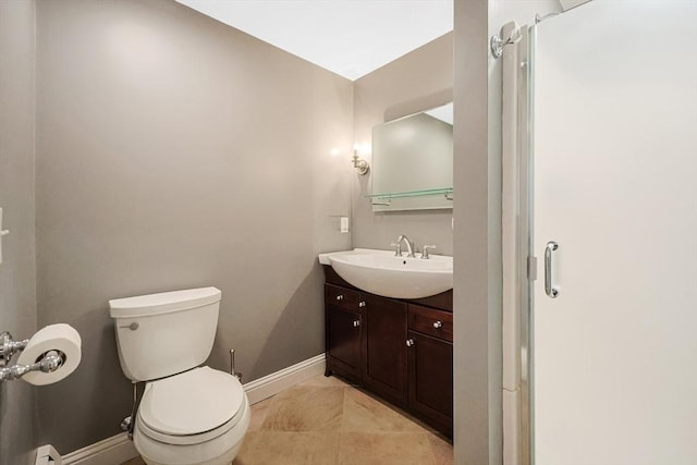 bathroom with tile patterned floors, baseboards, toilet, and vanity