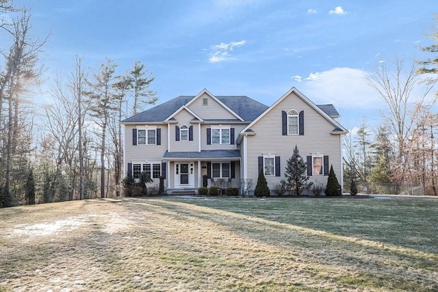 view of front of house with covered porch and a front yard