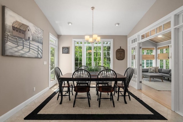267 W St, Northborough, MA 01532 - dining area with vaulted ceiling, a chandelier, light tile patterned floors, baseboards, and healthy amount of natural light