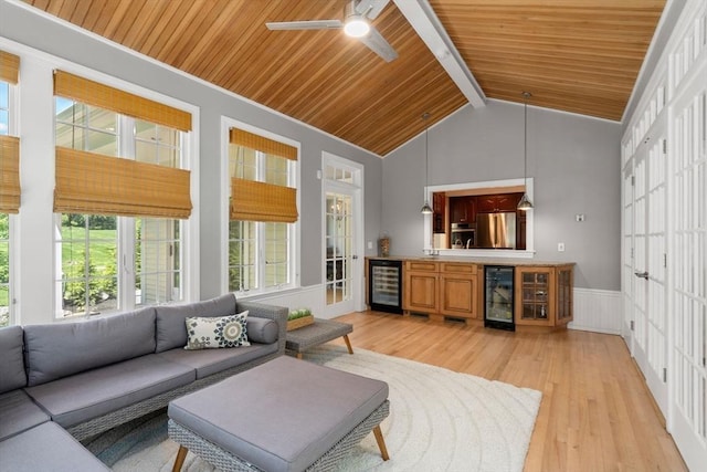 267 W St, Northborough, MA 01532 - living area featuring wine cooler, wooden ceiling, light wood-style flooring, ceiling fan, and wainscoting