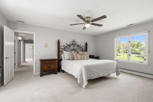 267 W St, Northborough, MA 01532 - bedroom featuring light carpet, ceiling fan, and a baseboard heating unit