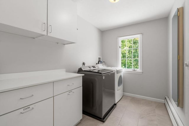 267 W St, Northborough, MA 01532 - washroom with a baseboard heating unit, cabinet space, separate washer and dryer, baseboards, and light tile patterned floors