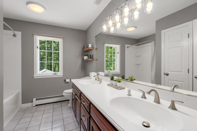 267 W St, Northborough, MA 01532 - full bath featuring a baseboard heating unit, double vanity, tile patterned flooring, bathing tub / shower combination, and baseboards