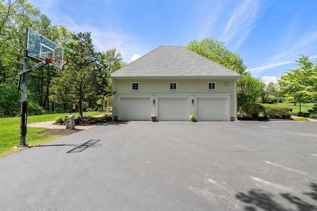 267 W St, Northborough, MA 01532 - detached garage featuring view of wooded area