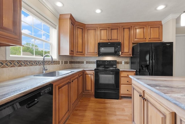 18 Skyview Dr, Brockton, MA 02301 - kitchen with black appliances, a sink, light countertops, backsplash, and recessed lighting