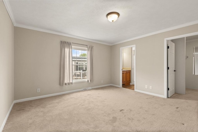 18 Skyview Dr, Brockton, MA 02301 - unfurnished bedroom with light colored carpet, baseboards, crown molding, ensuite bathroom, and a walk in closet
