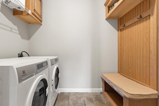18 Skyview Dr, Brockton, MA 02301 - laundry area featuring cabinet space, baseboards, and washing machine and clothes dryer