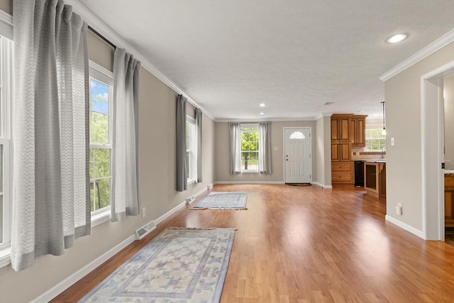 18 Skyview Dr, Brockton, MA 02301 - entrance foyer featuring crown molding, light wood finished floors, baseboards, and recessed lighting