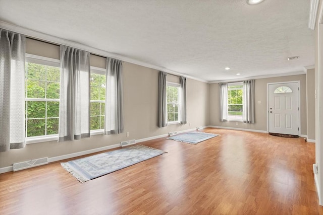 18 Skyview Dr, Brockton, MA 02301 - entrance foyer featuring crown molding, baseboards, wood finished floors, and recessed lighting