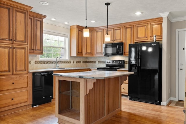 18 Skyview Dr, Brockton, MA 02301 - kitchen with black appliances, a sink, crown molding, brown cabinetry, and light wood finished floors