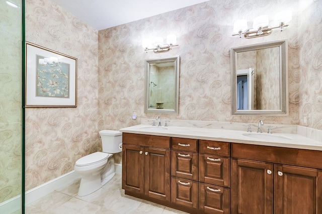 bathroom with tile patterned flooring, vanity, and toilet