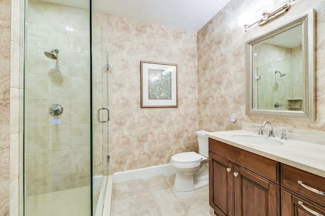 bathroom featuring vanity, toilet, and walk in shower