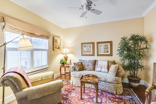 living room featuring wood-type flooring, ceiling fan, and crown molding