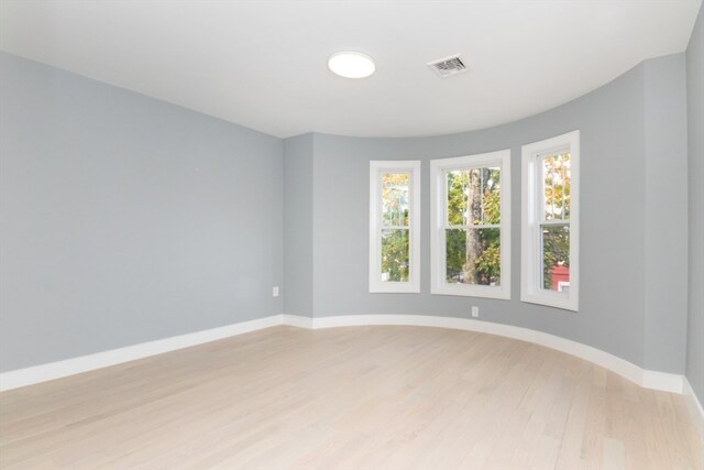 unfurnished room featuring light hardwood / wood-style flooring