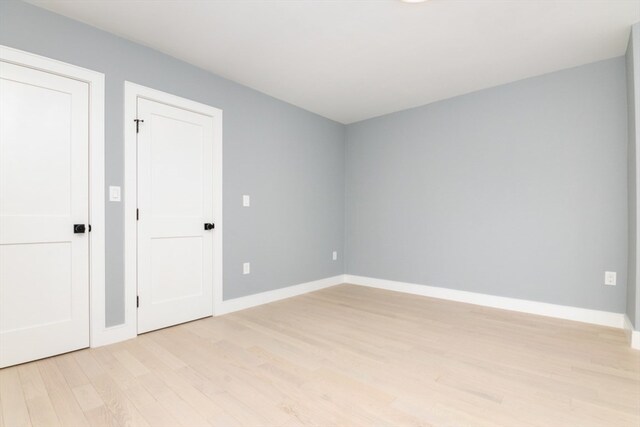 unfurnished room with light hardwood / wood-style flooring