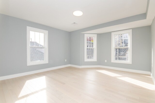 spare room with light hardwood / wood-style flooring