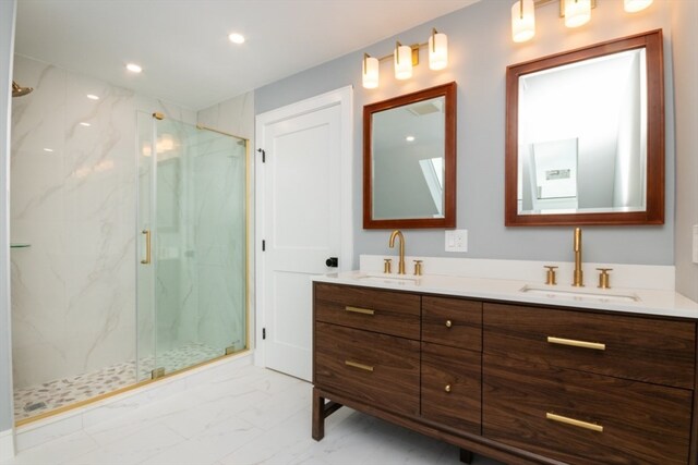 bathroom featuring vanity and an enclosed shower