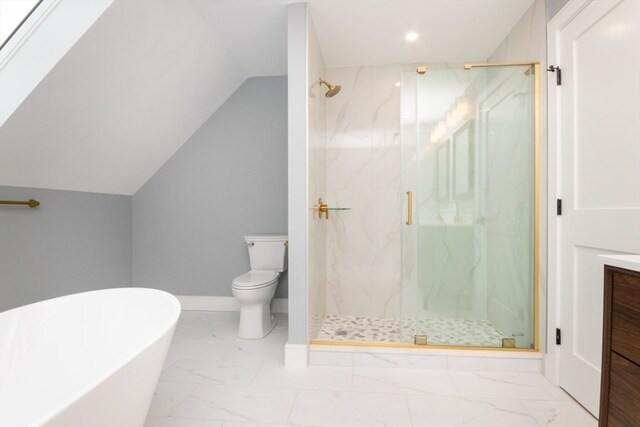 full bathroom with vanity, independent shower and bath, lofted ceiling with skylight, and toilet