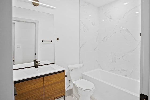 full bathroom featuring tiled shower / bath, vanity, and toilet