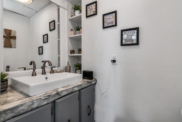 bathroom with built in features and vanity