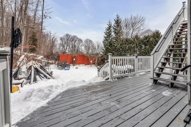 snow covered deck with stairs