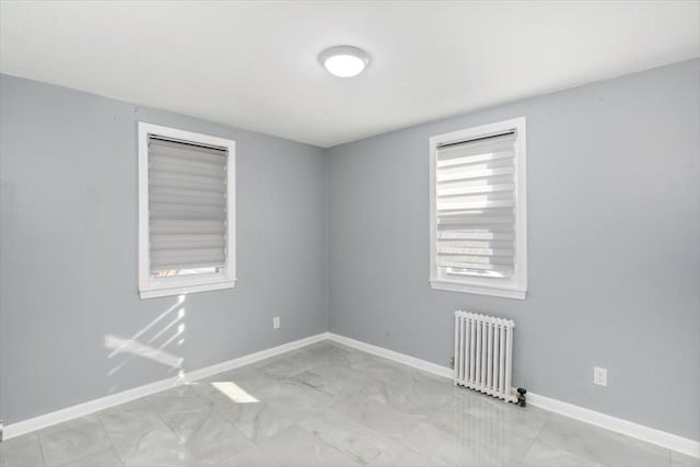 spare room with radiator heating unit