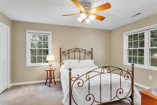 carpeted bedroom with ceiling fan