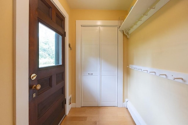 75 Union St, Holliston, MA 01746 - doorway with light wood-style flooring and baseboards