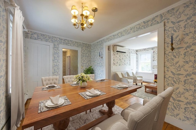 75 Union St, Holliston, MA 01746 - dining room featuring a wall unit AC, wallpapered walls, crown molding, a chandelier, and wood finished floors