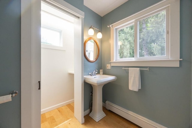75 Union St, Holliston, MA 01746 - bathroom featuring a baseboard radiator and wood finished floors