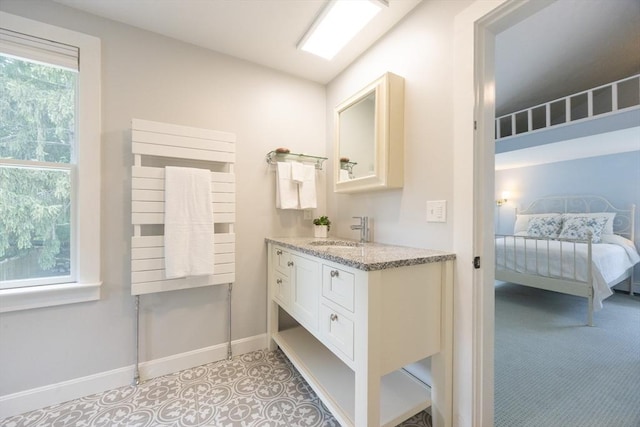 75 Union St, Holliston, MA 01746 - ensuite bathroom featuring vanity and baseboards
