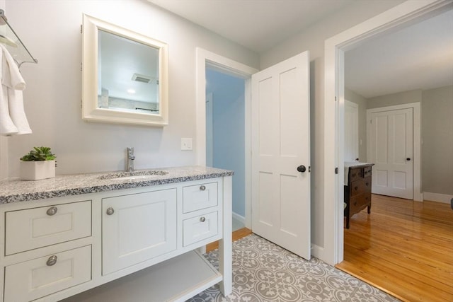 75 Union St, Holliston, MA 01746 - bathroom with vanity and wood finished floors