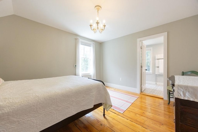 75 Union St, Holliston, MA 01746 - bedroom with a chandelier, light wood-style flooring, and multiple windows