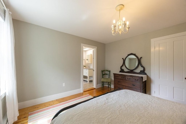 75 Union St, Holliston, MA 01746 - bedroom with a chandelier, wood finished floors, and connected bathroom